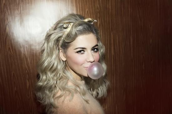 Marina blowing a bubble, with the diamonds